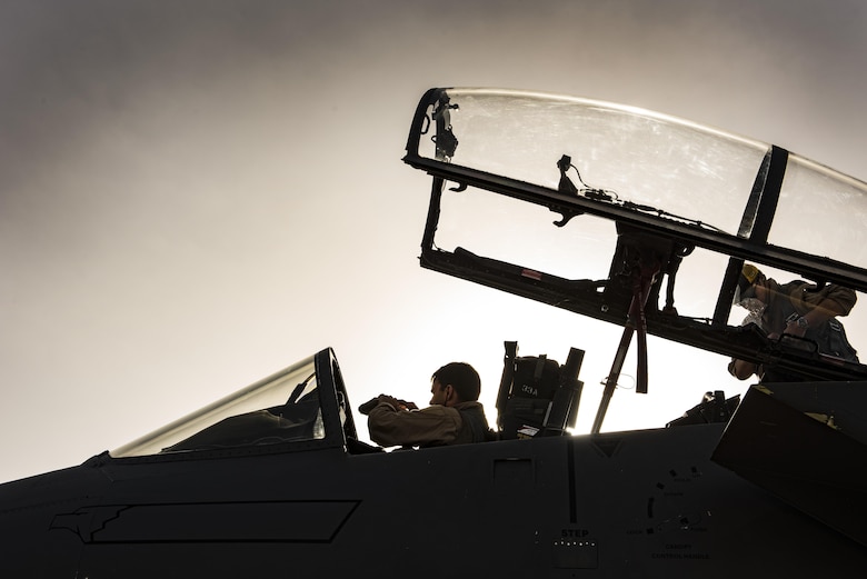 Aircrew members assigned to the 336th Expeditionary Fighter Squadron perform pre-flight checks prior to flying a sortie in support of Operation Inherent Resolve objectives November 3, 2017 in Southwest Asia. The squadron’s primary objective is the protection and support of Coalition forces on the ground via precision strikes and defensive counter-air operations. (U.S. Air Force photo by Senior Airman Joshua Kleinholz)