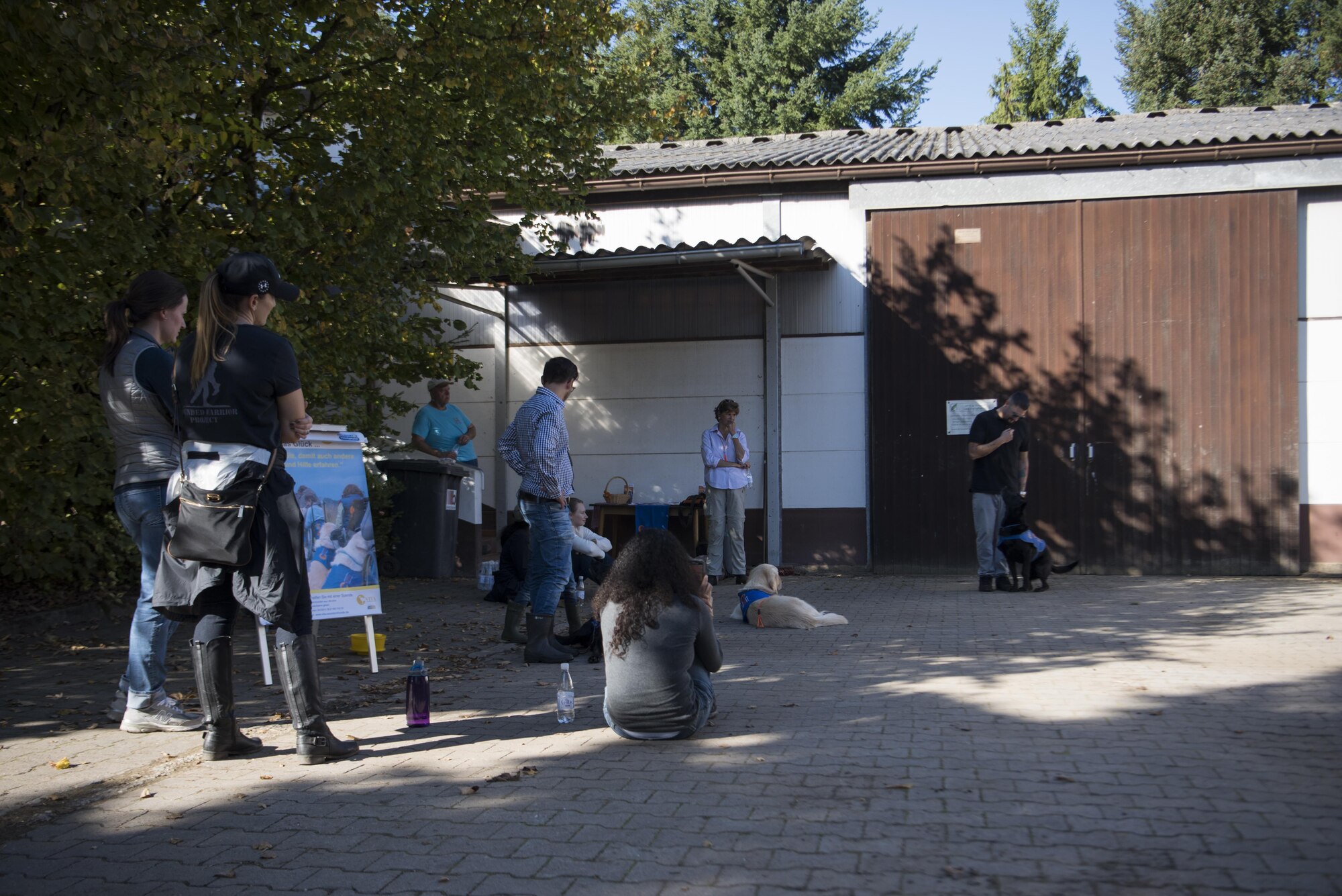 Members of the Kaiserslautern Military Community attend a service dog demonstration held in Kaiserslautern, Germany, Oct. 14, 2017. The demonstration displayed how service dogs help veterans with post-traumatic stress disorder. (U.S. Air Force photo by Airman 1st Class Devin M. Rumbaugh)