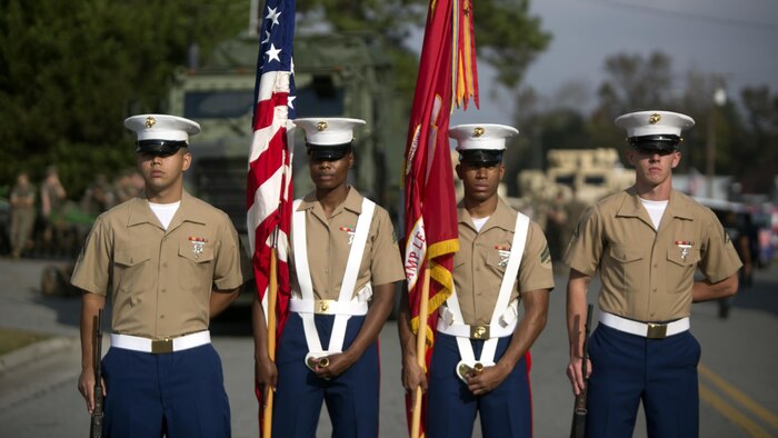 Marines with Headquaters and Support Battalion, Marine Corps Installations - East prepare to march in the Warsaw Veterans Day Parade in Warsaw, N.C., Nov. 4, 2017. T