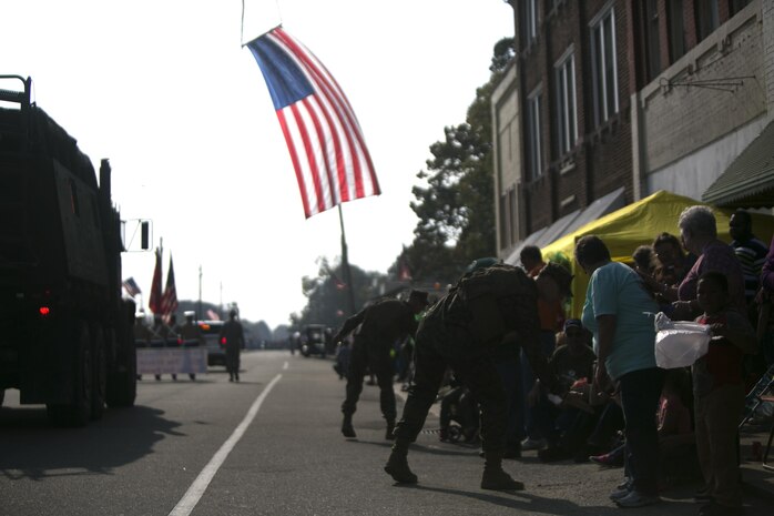 Marines with 1st Battalion, 10 Marine Regiment, 2nd Marine Division greet attendees of the Warsaw Veterans Day parade