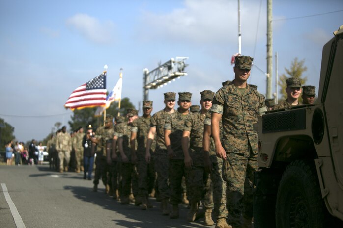 Marines with Combat Logistics Battalion 8 march together during the Warsaw Veterans Day Parade