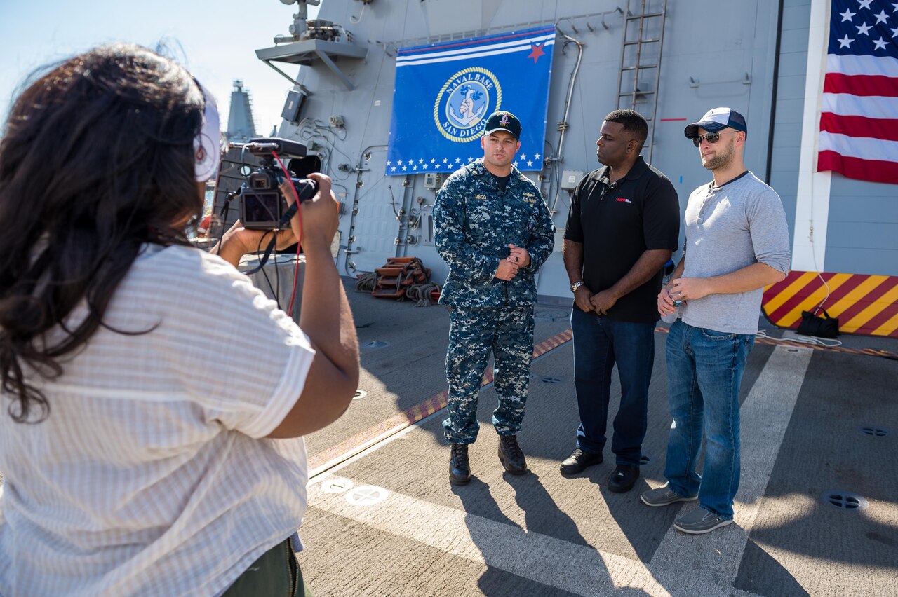 Navy Lt. Cmdr. Brett Ringo leads a tour of the littoral combat ship USS Freedom as part of a pre-taped segment for ESPN’s show “First Take,” in San Diego, Nov. 5, 2017. More than 150 sailors, veterans, family members and friends took part in the live broadcast on Nov. 6 of the show’s "A Salute to America's Heroes," in celebration of Veterans Day. Navy photo by Petty Officer 1st Class Chad M. Butler