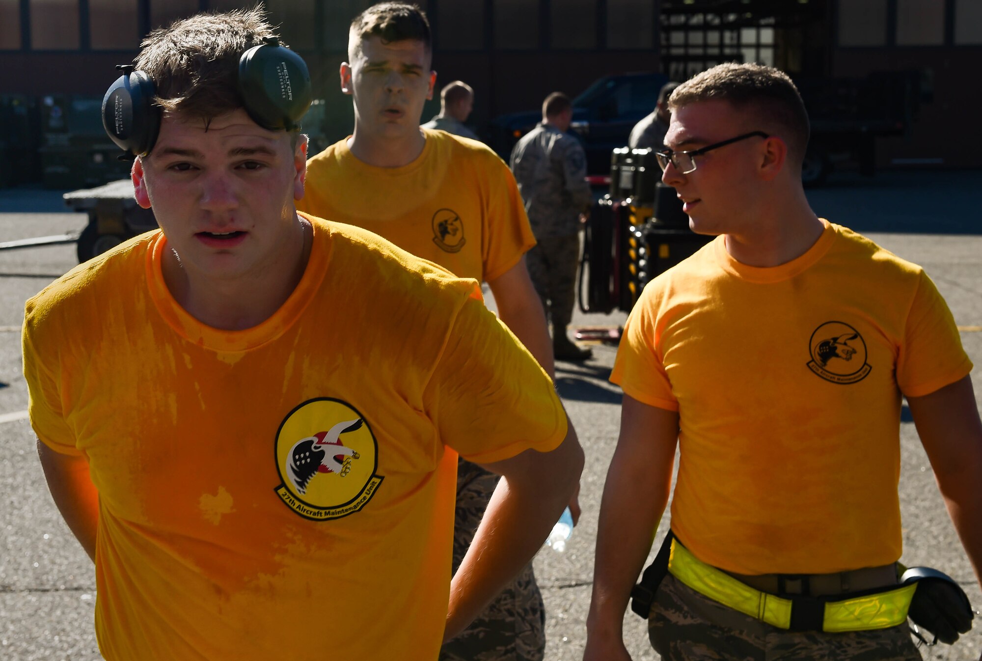 The 27th Aircraft Maintenance Unit load crew team walks back to the audience after competing in the 3rd Quarter Weapons Load Competition at Joint Base Langley-Eustis, Va., Nov. 3, 2017.