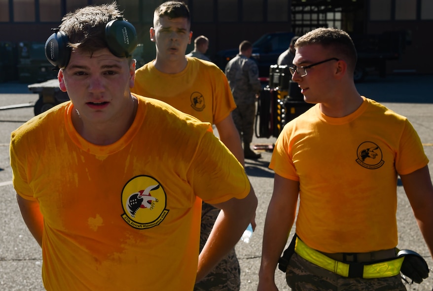 The 27th Aircraft Maintenance Unit load crew team walks back to the audience after competing in the 3rd Quarter Weapons Load Competition at Joint Base Langley-Eustis, Va., Nov. 3, 2017.