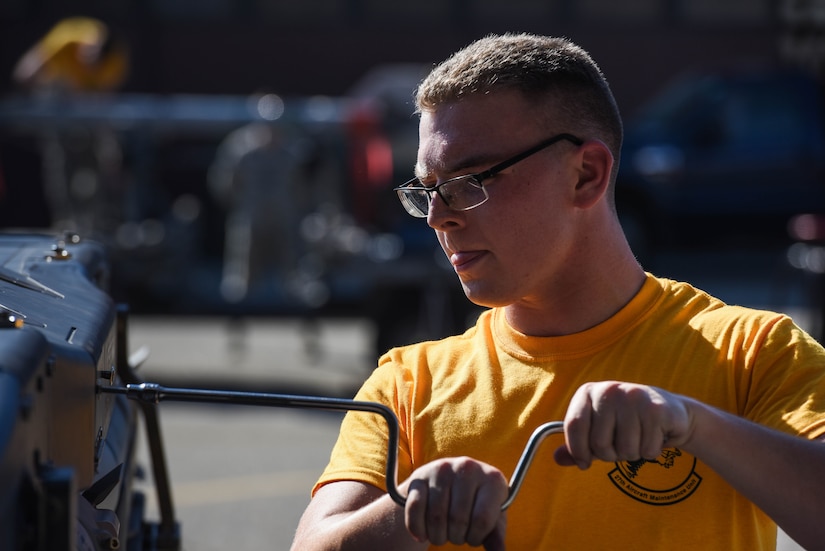 U.S. Air Force Airman 1st Class Cody Rhodes, 27th Aircraft Maintenance Unit load crew member, prepares to load a preloaded BRU-61 on to a U.S. Air Force F-22 Raptor during the 3rd Quarter Weapons Load Competition at Joint Base Langley-Eustis, Va., Nov. 3, 2017.