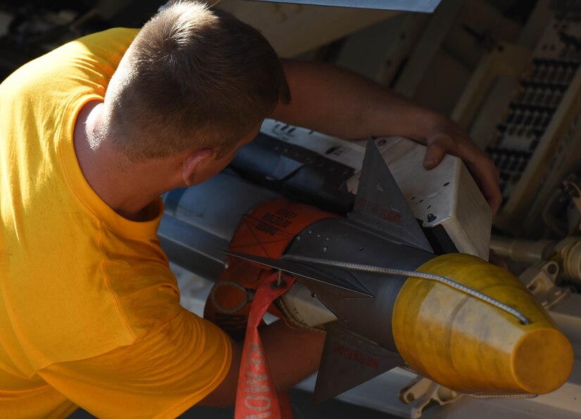 U.S. Air Force Airman 1st Class Zachery Semmer, 27th Aircraft Maintenance Unit load crew member, loads an AIM-9X missile onto a U.S. Air Force F-22 Raptor during the 3rd Quarter Weapons Load Competition at Joint Base Langley-Eustis, Va., Nov. 3, 2017.