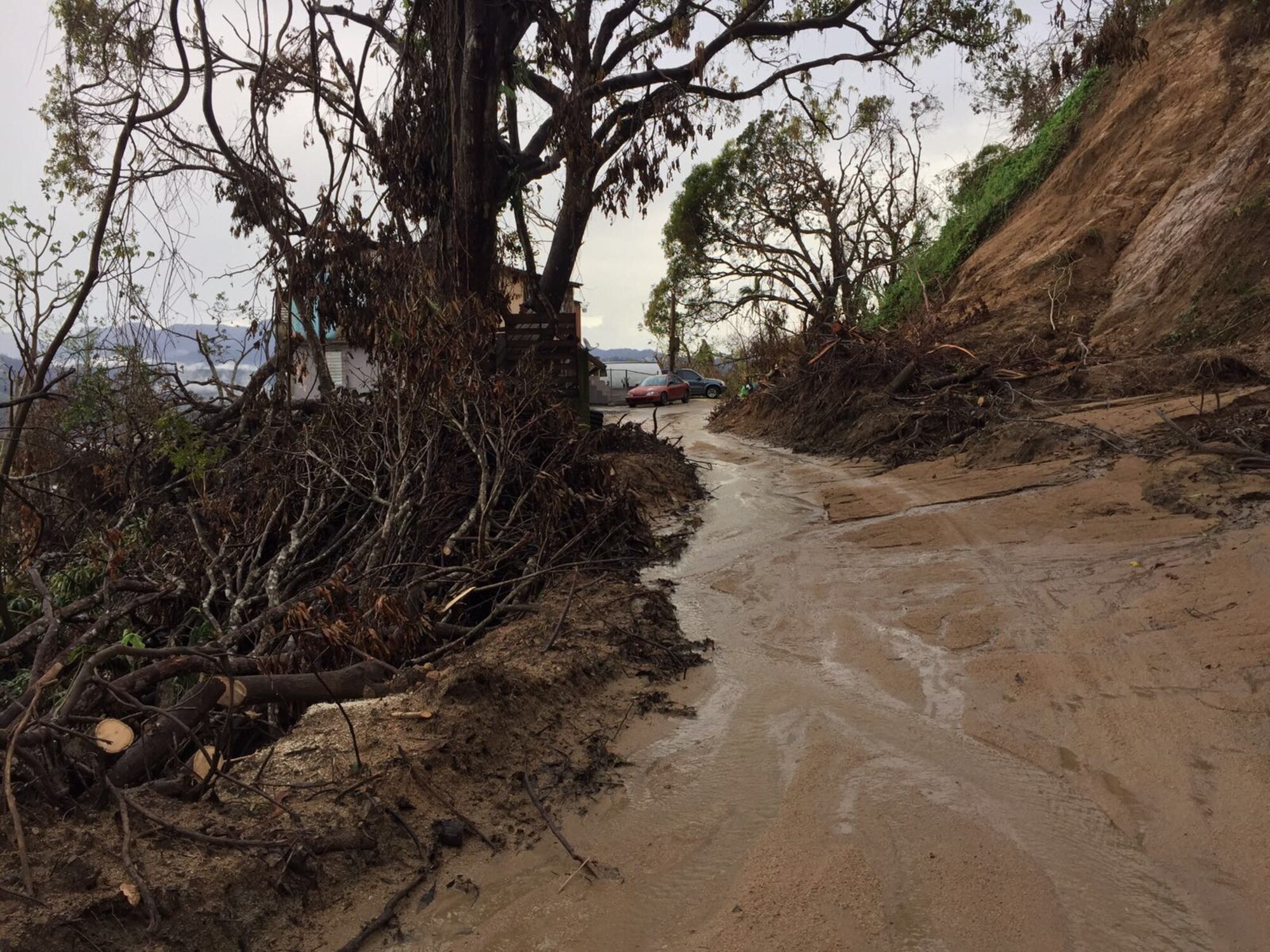 UTUADO, Puerto Rico – Washington Air National Guardsman Master Sgt. Richard Dessert travels the treacherous roads near Utuado in order to deliver Hurricane Maria relief supplies Oct. 5, 2017.  Dessert volunteered to deploy in support of his civilian employer, World Vision, to provide Hurricane Maria relief and IT support.  (Courtesy photo by Richard Dessert)