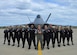 F-22 Raptor Demonstration Team pose for photo in front of an F-22 Raptor