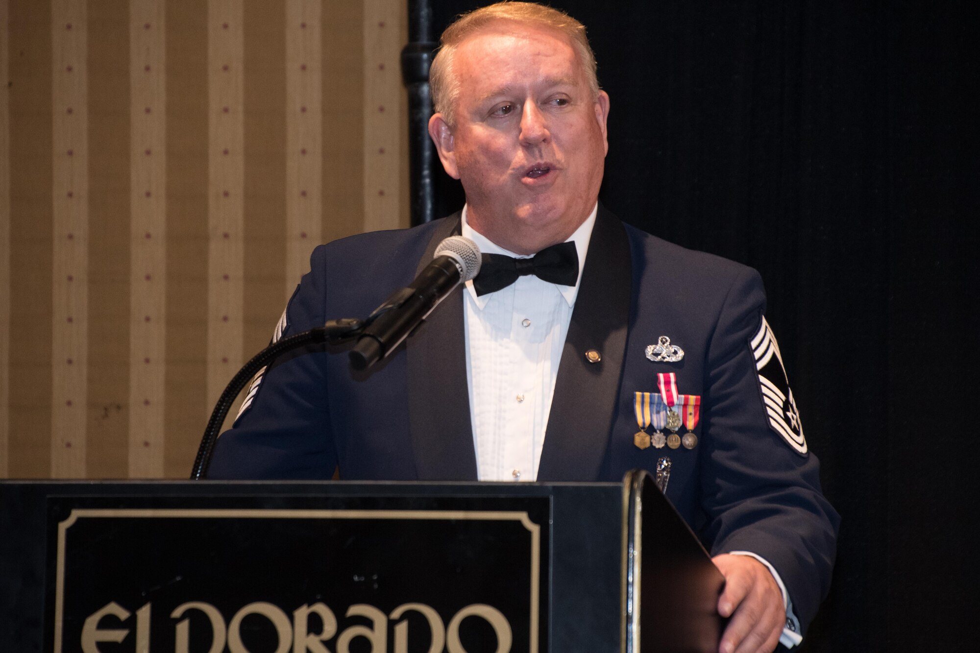 Retired Chief Master Sgt. Paul LaFlame, president of the Louisiana State Air Force Association, talks about the importance of taking care of Airmen during the 307th Bomb Wing Senior Noncommissioned Officer Induction and Chief Recognition Ceremony in Shreveport, La. Nov. 4, 2017.
