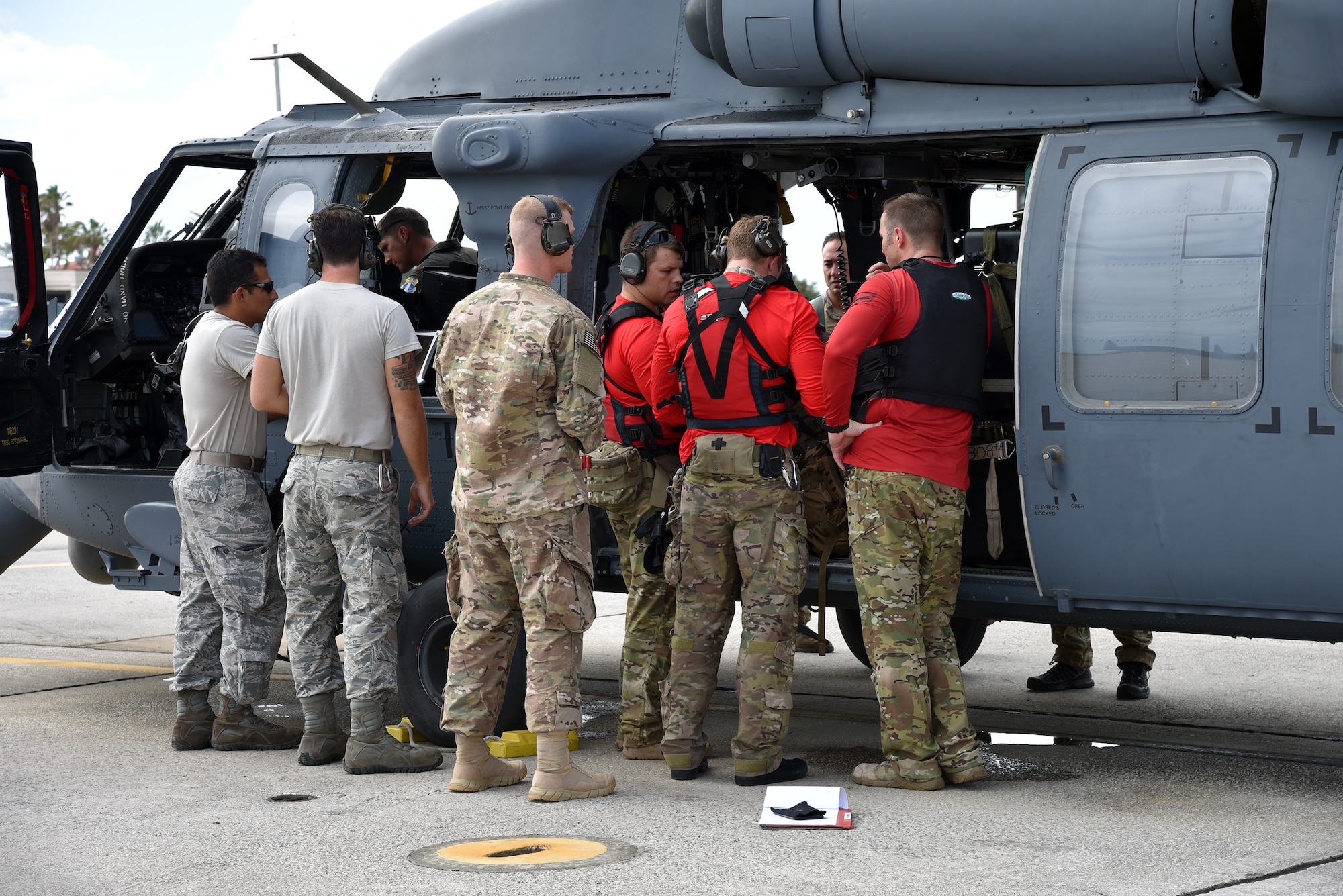 Rescue Airmen conduct a medical evacuation of cruise passenger at sea