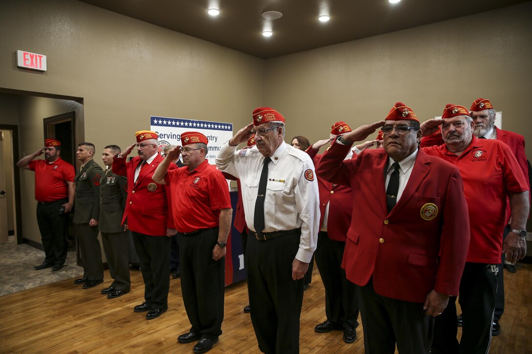 Members of the Marine Corps League Detachment, salute during a Silver Star Award ceremony in honor of Lance Cpl. Donald J. Cline on Marine Corps League Detachment 1419, Mandan, North Dakota, Nov 1, 2017.