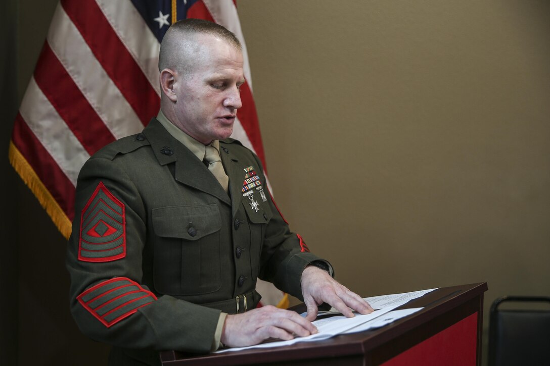 U.S. Marine 1st Sgt Richard S. Mostoller, Inspector-Instructor First Sergeant, Support Company, 4th Law Enforcement Battalion speaks at during Silver Star Award ceremony in honor of Lance Cpl. Donald J. Cline on Marine Corps League Detachment 1419, Mandan, North Dakota, Nov 1, 2017.
