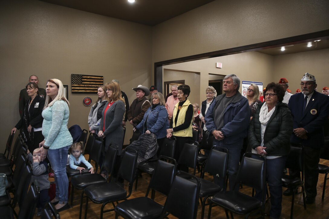 Guests stand during a Silver Star Award ceremony in honor of Lance Cpl. Donald J. Cline on Marine Corps League Detachment 1419, Mandan, North Dakota, Nov 1, 2017.