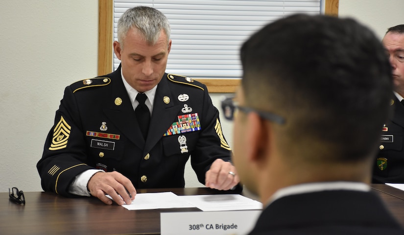 308th Civil Affairs Brigade Command Sgt. Maj. Thomas Walsh questions Spc. Pedro Benavides, from 407th Civil Affairs Battalion, during an evaluation Board at the 353rd Civil Affairs Command Best Warrior Competition at Fort McCoy, Wisconsin, November 4, 2017.
(U.S. Army Reserve photo by Catherine Lowrey, 88th Regional Support Command Public Affairs Office)