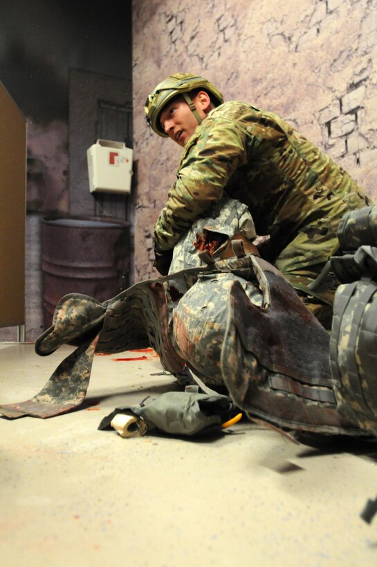 Competitor Staff Sgt. Loren Keeler, from 407th Civil Affairs Battalion, assesses and treats a simulated casualty during the 353rd Civil Affairs Command Best Warrior Competition held at Fort McCoy, Wisconsin, November 1, 2017. Keeler went on to win the title of 353rd CACOM 2017 Non-Commissioned Officer of the Year.
(U.S. Army Reserve photo by Zach Mott, 88th Regional Support Command Public Affairs Office)
