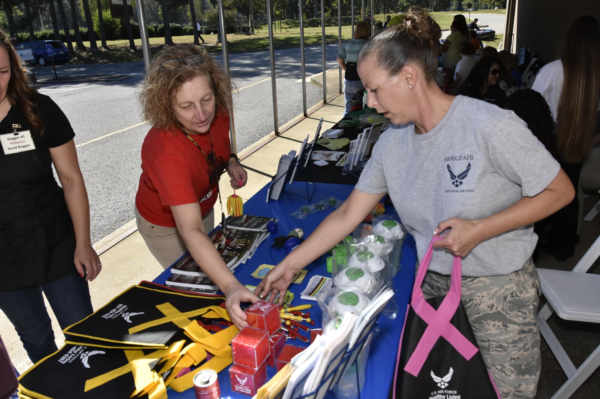 Tech. Sgt. Beverly Spademan (right), a non-commissioned officer in charge of Medical Administration at Arnold Air Force Base, discusses services offered at the Medical Aid Station with an employee during the Arnold Air Force Base Community Health Fair Sept. 29. More than 100 military and civilian visitors attended the health fair. (U.S. Air Force photo/Rick Goodfriend)