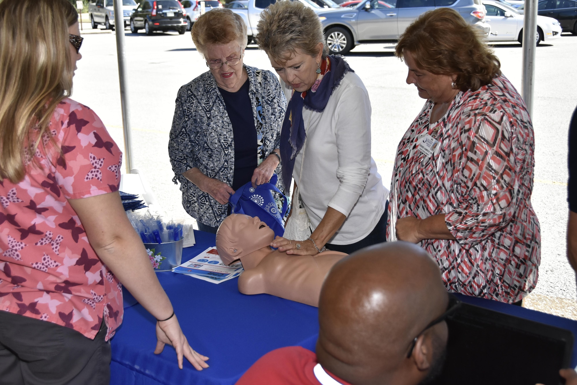 Participants at the Arnold Air Force Base Community Health Fair Sept. 29, experience the feel of administering CPR through one of the exhibitors. The health fair was hosted by the Arnold AFB Medical Aid Station. Health and Safety professionals were on hand to talk about diabetes, ergonomics, dental health, tobacco cessation, heart disease, physical therapy, nutrition, emergency preparation and fire extinguisher safety from the Arnold AFB Fire Department. (U.S. Air Force photo/Rick Goodfriend)
