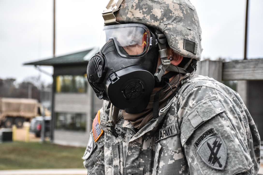Sergeant Dyami Kellyclark, 443rd Civil Affairs Battalion, wears his gas mask on the M16 range at the 353rd Civil Affairs Command Best Warrior Competition at Fort McCoy, Wisconsin, November 2, 2017. 
(U.S. Army Reserve photo by Catherine Lowrey, 88th Regional Support Command Public Affairs Office)