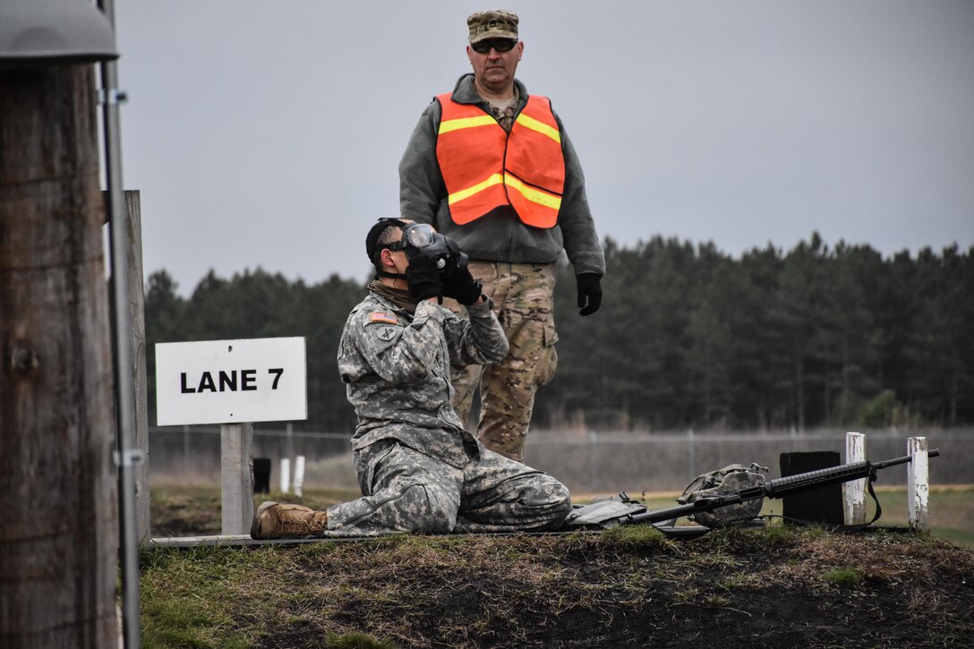 Sergeant Dyami Kellyclark, 443rd Civil Affairs Battalion, dons his gas mask on the M16 range at the 353rd Civil Affairs Command Best Warrior Competition at Fort McCoy, Wisconsin, November 2, 2017. 
(U.S. Army Reserve photo by Catherine Lowrey, 88th Regional Support Command Public Affairs Office)