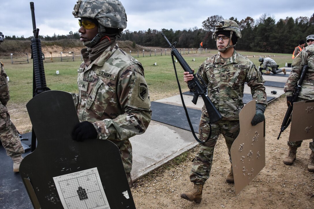 Soldiers competing in the 353rd Civil Affairs Command Best Warrior Competition collect their targets from the M16 rifle range at Fort McCoy, Wisconsin, November 2, 2017.
(U.S. Army Reserve photo by Catherine Lowrey, 88th Regional Support Command Public Affairs Office)