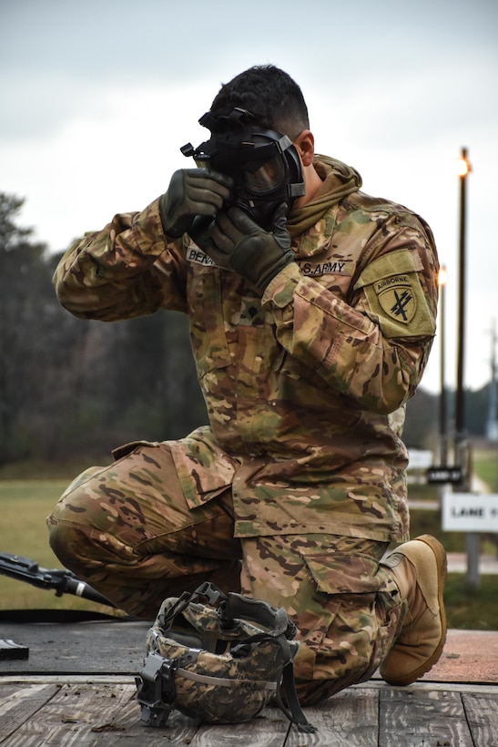 Specialist Pedro Benavides, from 407th Civil Affairs Battalion, dons his gas mask during the 353rd Civil Affairs Command Best Warrior Competition at Fort McCoy, Wisconsin, November 2, 2017.
(U.S. Army Reserve photo by Catherine Lowrey, 88th Regional Support Command Public Affairs Office)