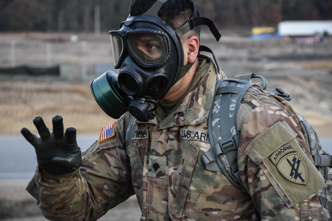 Specialist Pedro Benavides, from 407th Civil Affairs Battalion, wears his gas mask during the 353rd Civil Affairs Command Best Warrior Competition at Fort McCoy, Wisconsin, November 3, 2017.
(U.S. Army Reserve photo by Catherine Lowrey, 88th Regional Support Command Public Affairs Office)