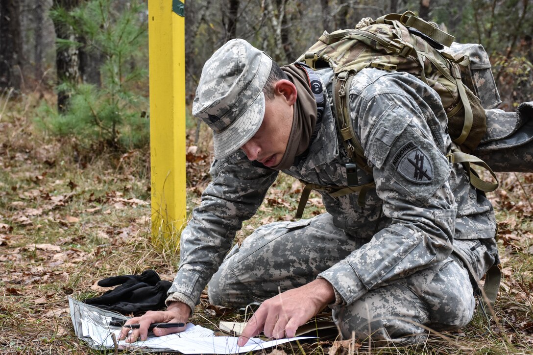 Sergeant Dyami Kellyclark, 443rd Civil Affairs Battalion, plots grid coordinates during the Land Navigation Course at the 353rd Civil Affairs Command Best Warrior Competition at Fort McCoy, Wisconsin, November 3, 2017.
(U.S. Army Reserve photo by Catherine Lowrey, 88th Regional Support Command Public Affairs Office)