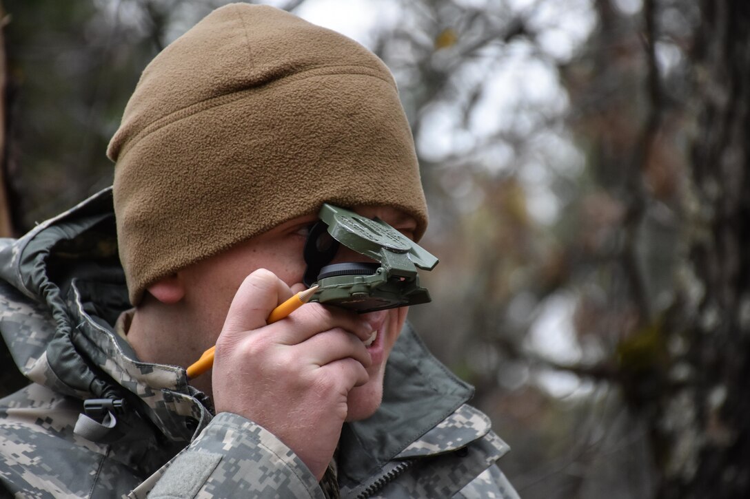 Specialist Christian Patton, 304th Civil Affairs Brigade, finds his next point on the Land Navigation Course during the 353rd Civil Affairs Command Best Warrior Competition at Fort McCoy, Wisconsin, November 3, 2017.
(U.S. Army Reserve photo by Catherine Lowrey, 88th Regional Support Command Public Affairs Office)