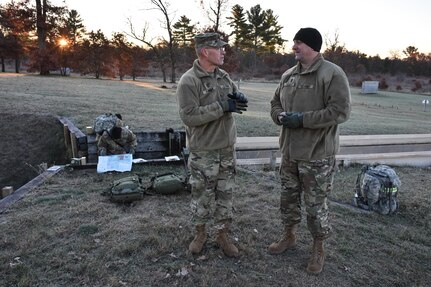 U.S. Army Civil Affairs & Psychological Operations Command (Airborne) Command Sgt. Maj. Pete Running, left, talks with 353rd Civil Affairs Command Sgt. Maj. Stephen Coville, right, during the Army Warrior Task lanes at the 353rd Civil Affairs Command Best Warrior Competition at Fort McCoy, Wisconsin, November 3, 2017.
(U.S. Army Reserve photo by Catherine Lowrey, 88th Regional Support Command Public Affairs Office)