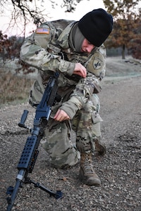 Private Second Class Yanni Tsiranides, 411th Civil Affairs Battalion, performs a functions check on a weapon during the Army Warrior Task lanes at the 353rd Civil Affairs Command Best Warrior Competition at Fort McCoy, Wisconsin, November 3, 2017. Tsiranides went on to win the title of 353rd CACOM 2017 Soldier of the Year. 
(U.S. Army Reserve photo by Catherine Lowrey, 88th Regional Support Command Public Affairs Office)