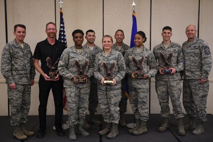 Col. Jeff Nelson, 628th Air Base Wing commander, far left, and Chief Master Sgt. Todd Cole, 628th ABW command chief, stand with the winners from the 628th ABW 3rd Quarter Awards ceremony at the Charleston Club, Joint Base Charleston, S.C., Nov. 8, 2017.Club in Joint Base Charleston, S.C., Nov. 8, 2017.
