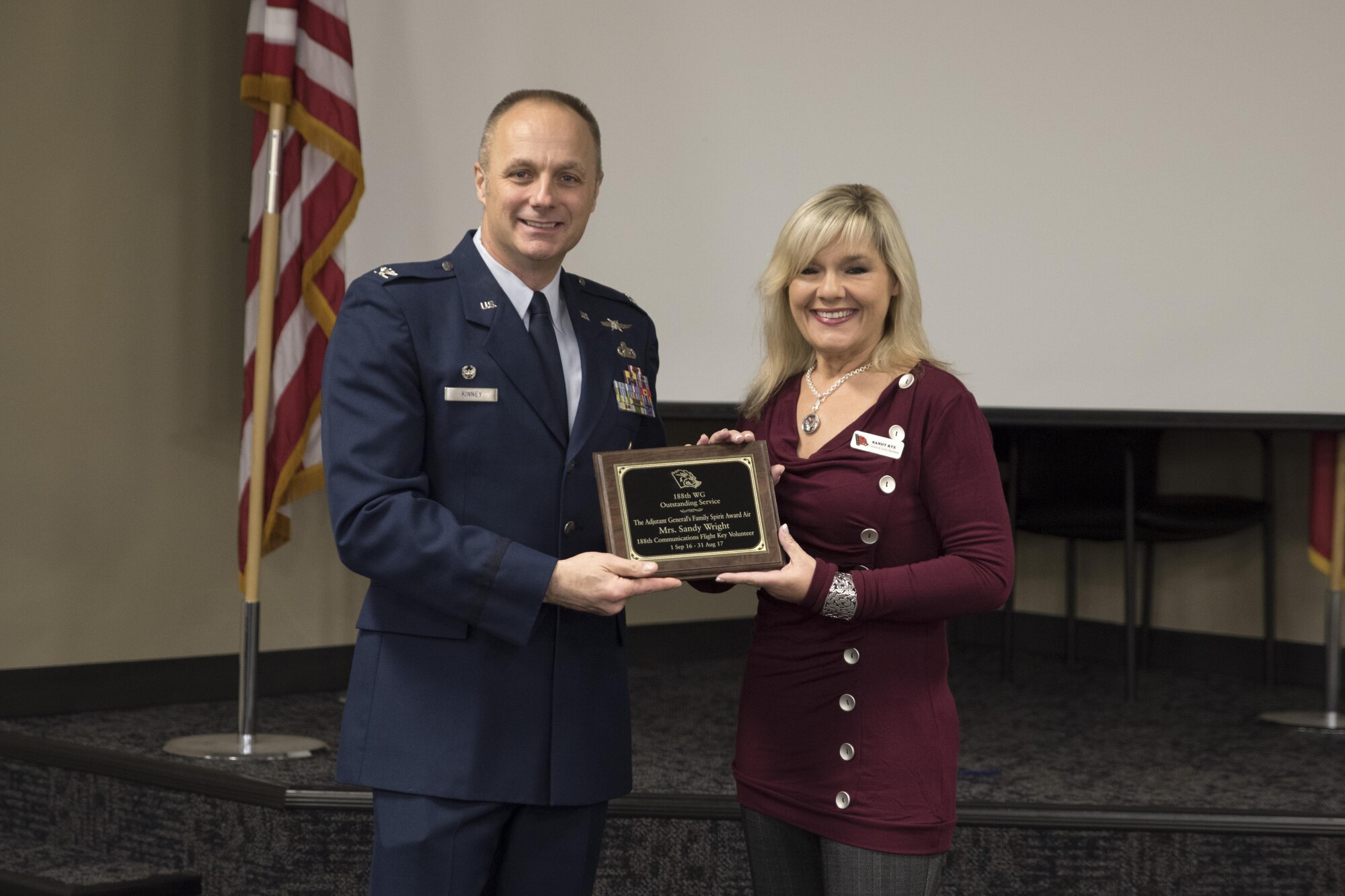 Sandra Rye, 188th Communications Flight Key volunteer, received the 2017 Adjutant General’s Family Spirit Award from Col. Robert Kinney, 188th Wing commander, Nov. 4, 2017, at Ebbing Air National Guard Base, Fort Smith, Ark. The key volunteer award is given to individuals that show outstanding and exceptional service to the Family Program.  (U.S. Air National Guard photo by Tech. Sgt. Daniel Condit)