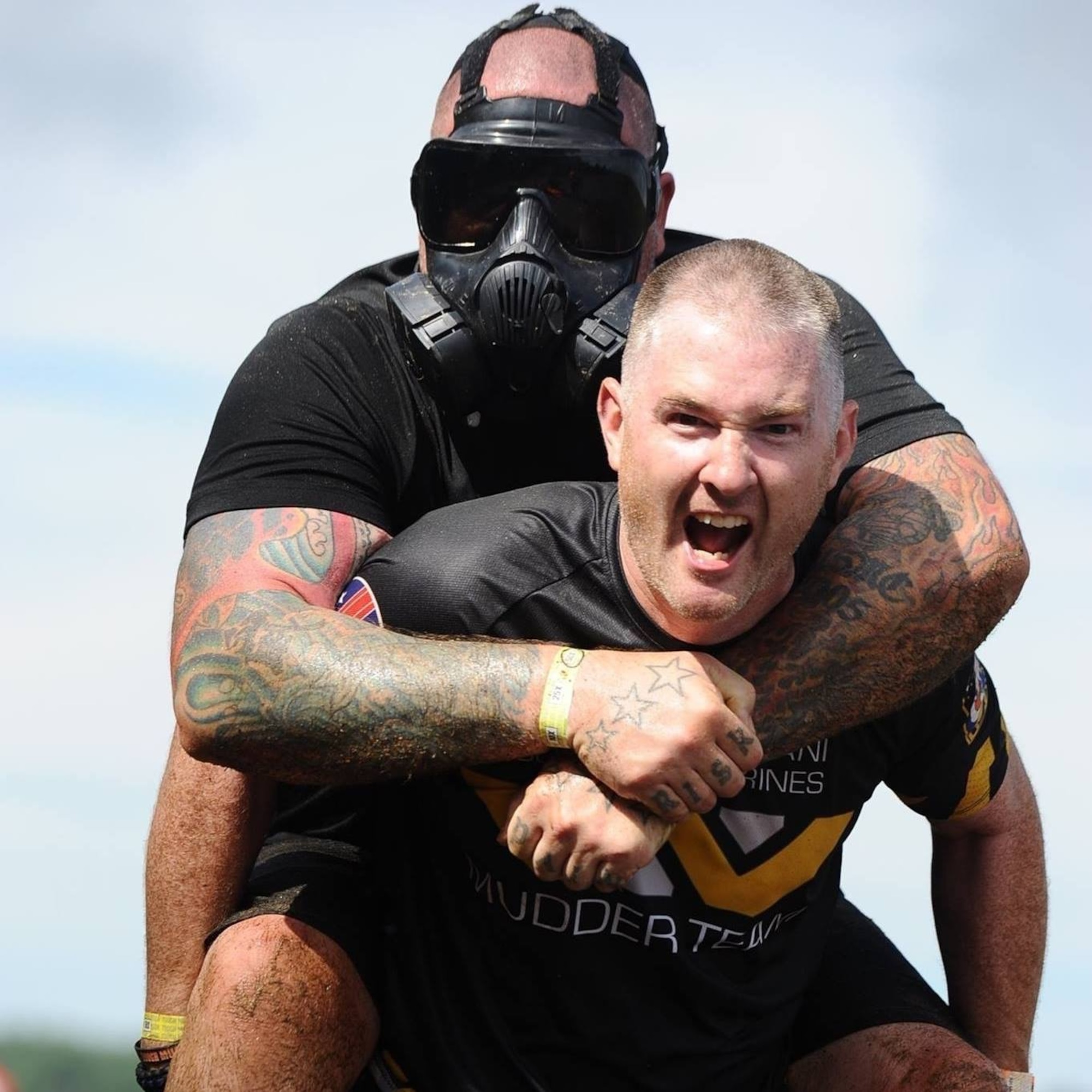 Master Sgt. Saul M. Davidson carries a teammate during a Tough Mudder Race. Davidson currently stands in fourth place in the male 40-44 year-old age group in the Tough Mudder Global standings and he will be competing in the World's Toughest Mudder Race Veterans Day weekend. Courtesy Photo from Tough Mudder.