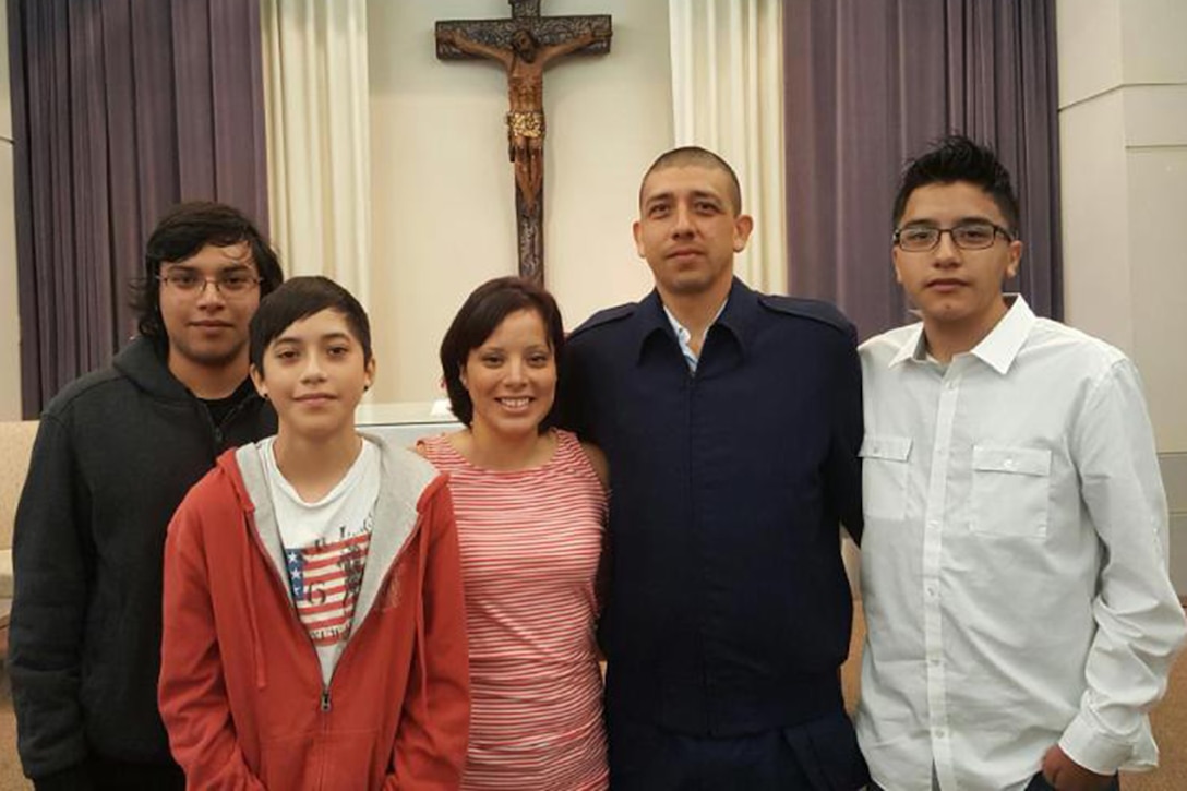 Airman 1st Class Mark Martinez, 341st Logistics Readiness Squadron vehicle operator, second from right, his wife Theresa and their sons Mark, pose for a photo.