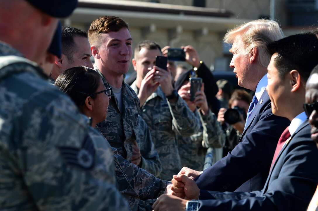 The president greets service members.