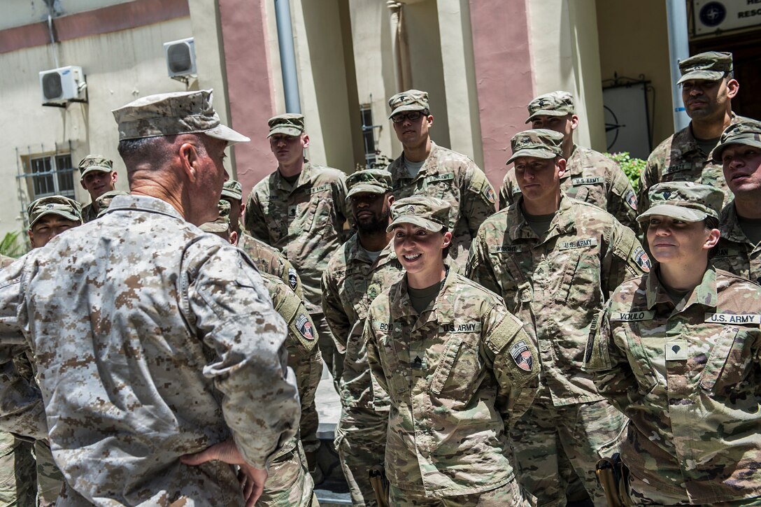 The chairman of the Joint Chiefs of Staff speaks with soldiers in Afghanistan.