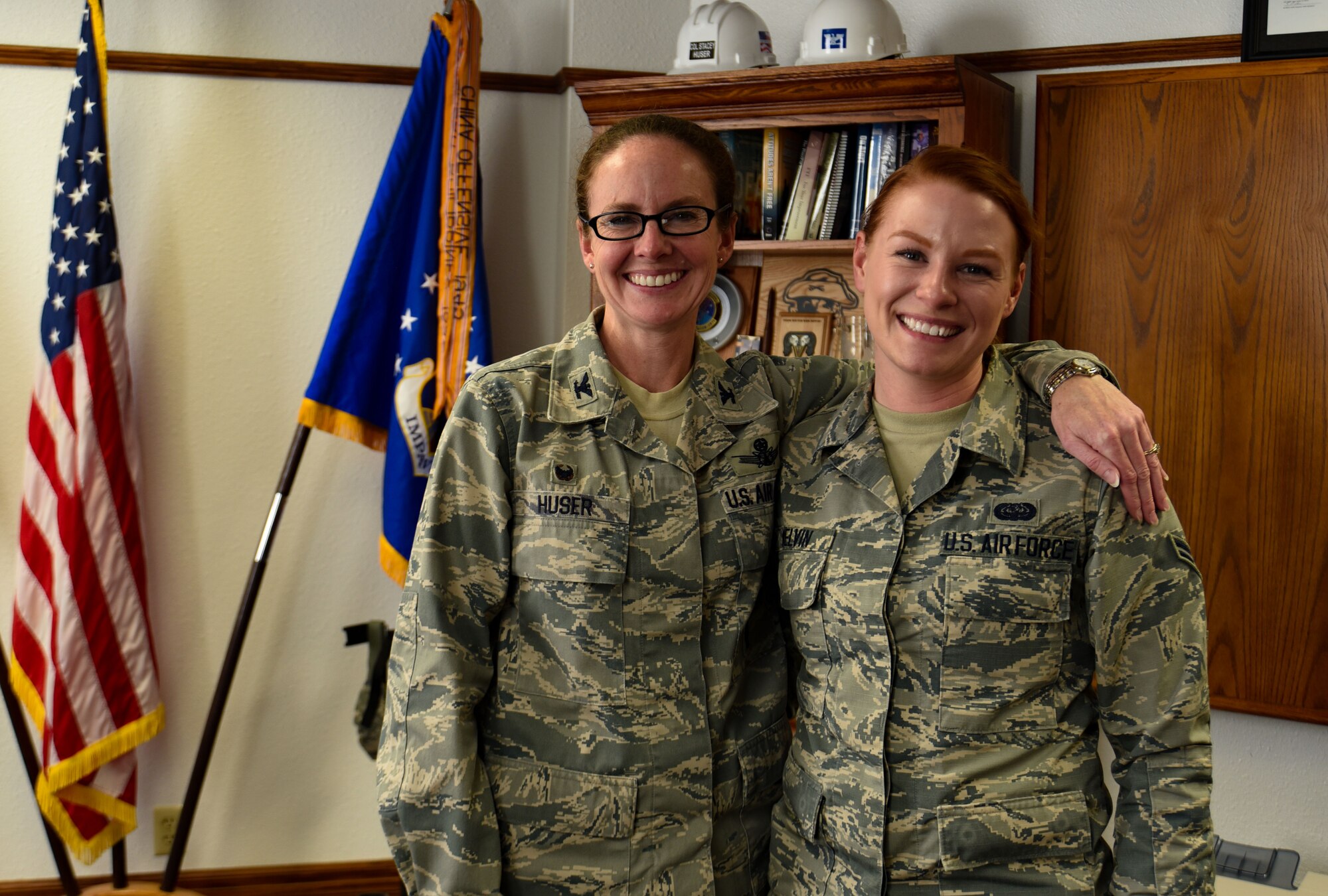 Commander poses with Airman