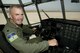 Lt. Col.  Luke Thompson, the  302nd Airlift Wing chief of aerial firefighting and command pilot, sits behind the flight controls of an Air Force Reserve C-130 Hercules aircraft on the Peterson Air Force Base flightline, Sept. 13, 2017.