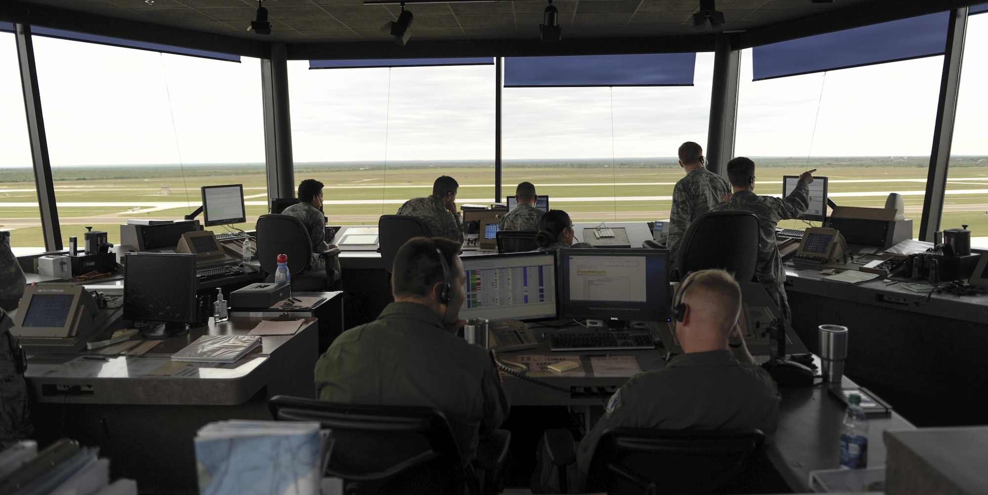 Airmen of the 47th Operations Support Squadron air traffic control tower perform their daily operations at Laughlin Air Force Base, Texas, Oct. 24, 2017. Laughlin’s tower is capable of operating with just four air traffic controllers, but with a busy training schedule, controllers in training must shadow certified controllers, which sometimes brings that number to eight. (U.S. Air Force/Airman 1st Class Benjamin N. Valmoja)