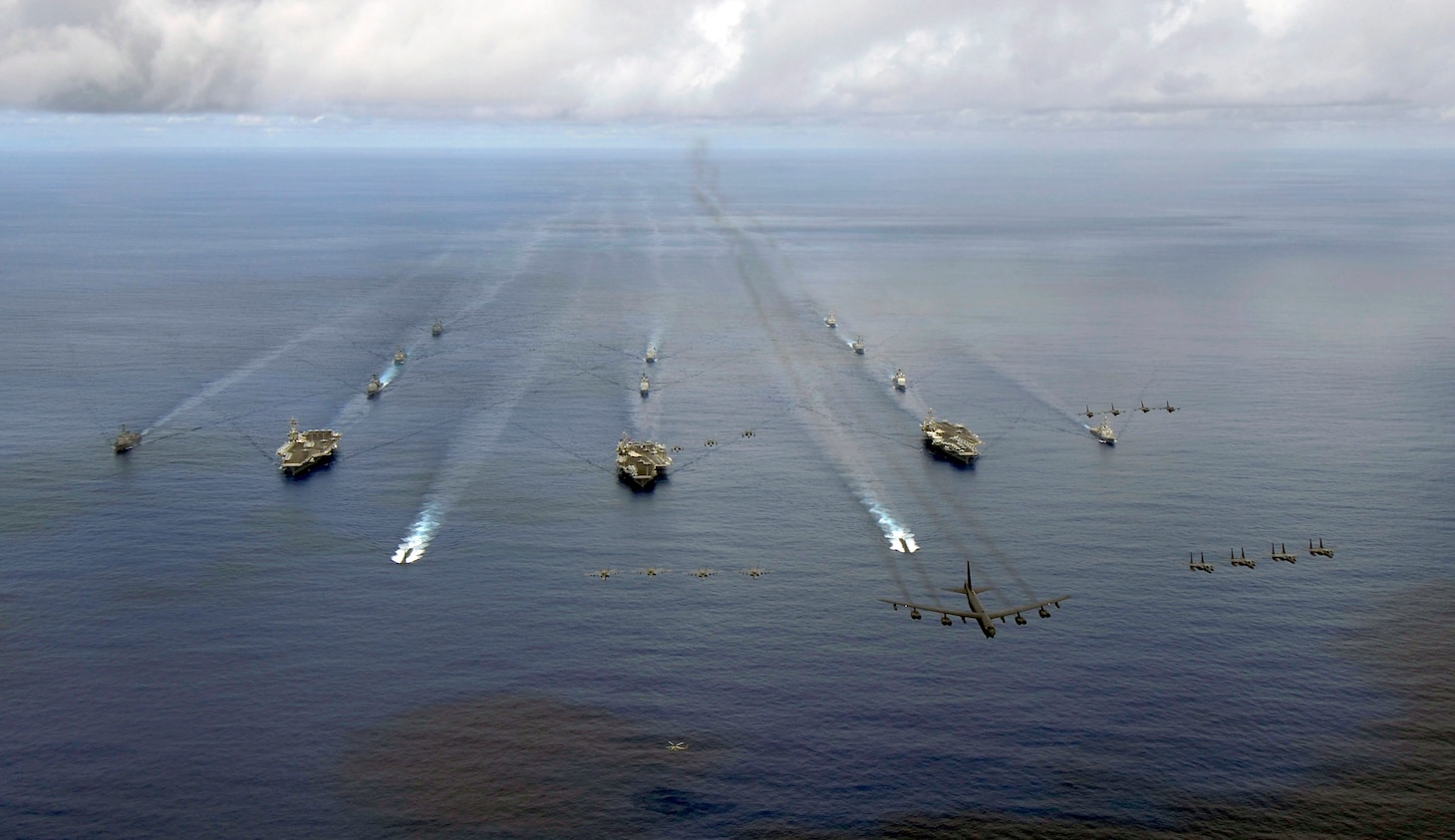 File photo: USS KITTY HAWK, at sea (Aug.14, 2007) - USS Nimitz (CVN 68), USS Kitty Hawk (CV 63), and USS John C. Stennis (CVN 74) carrier strike groups steam in formation during a joint photo exercise (PHOTOEX) during exercise Valiant Shield 2007 Aug.14.