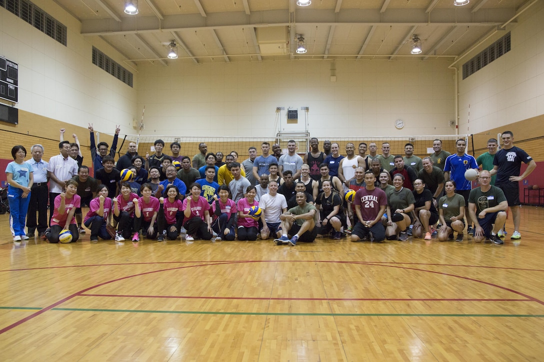 CAMP FOSTER, OKINAWA, Japan – Participants in the Friendship Volleyball Event pose for a group photo Nov. 7 aboard Camp Foster, Okinawa, Japan.
