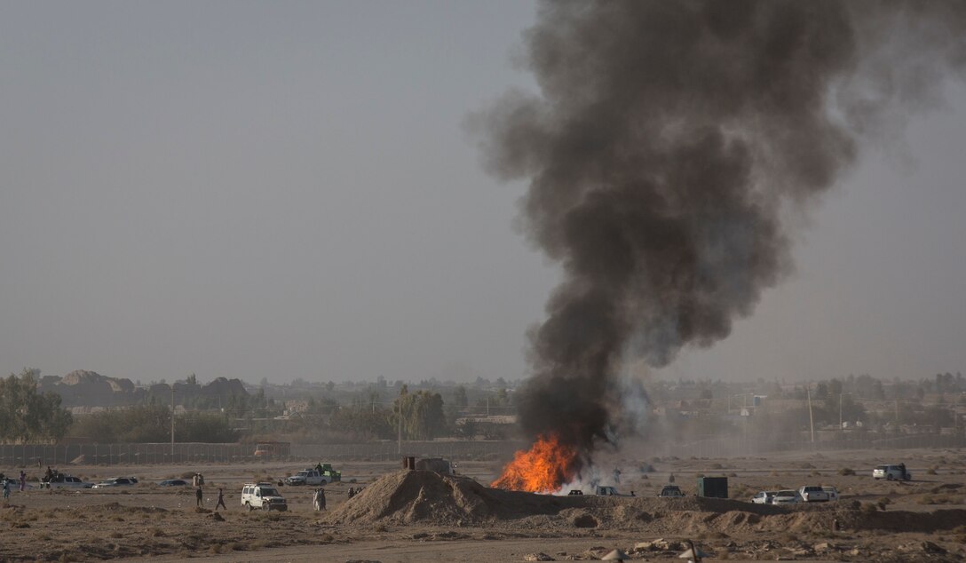 The Afghan National Police set approximately three tons of confiscated drugs on fire during a controlled drug burn at Bost Airfield, Afghanistan, Nov. 2, 2017. The ANP burned four years’ worth of evidence from court cases in Helmand Province. This periodic burn included opium, heroin, hashish, various chemicals, alcohol and morphine. (U.S. Marine Corps photo by Sgt. Justin T. Updegraff)