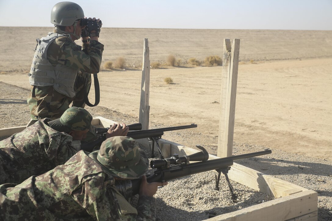 An Afghan National Army soldier with 6th Kandak, 1st Brigade 215th Corps prepares to fire an M24 sniper rifle during a battle sight zero range at Camp Shorabak, Afghanistan, Nov. 11, 2017. Approximately 15 soldiers with the unit are working to enhance their long-range firing capabilities as part of the operational readiness cycle. Led by ANA instructors, the ORC is an eight-week course designed to build the infantry skills and techniques of its students in order to support combat missions against the Taliban in Helmand province. (U.S. Marine Corps photo by Sgt. Lucas Hopkins)