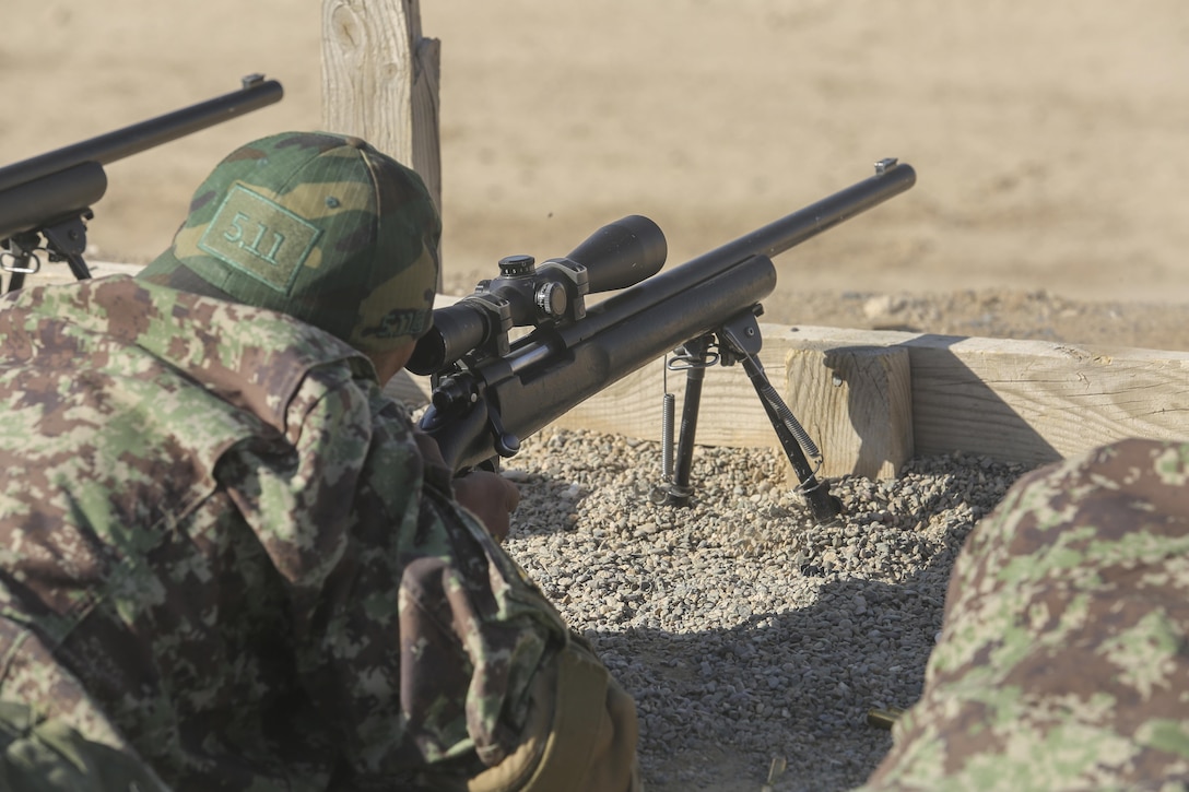 An Afghan National Army soldier with 6th Kandak, 1st Brigade, 215th Corps fires an M24 sniper rifle during a battle sight zero range at Camp Shorabak, Afghanistan, Nov. 11, 2017. As part of the operational readiness cycle, approximately 15 soldiers with the unit are completing sniper training to more effectively gather intelligence and provide long-range firing capabilities during future combat missions in Helmand province. U.S. Marine advisors with Task Force Southwest are assisting ANA instructors throughout the eight-week ORC, helping to generate a lethal and capable force to fight the Taliban throughout the province. (U.S. Marine Corps photo by Sgt. Lucas Hopkins)