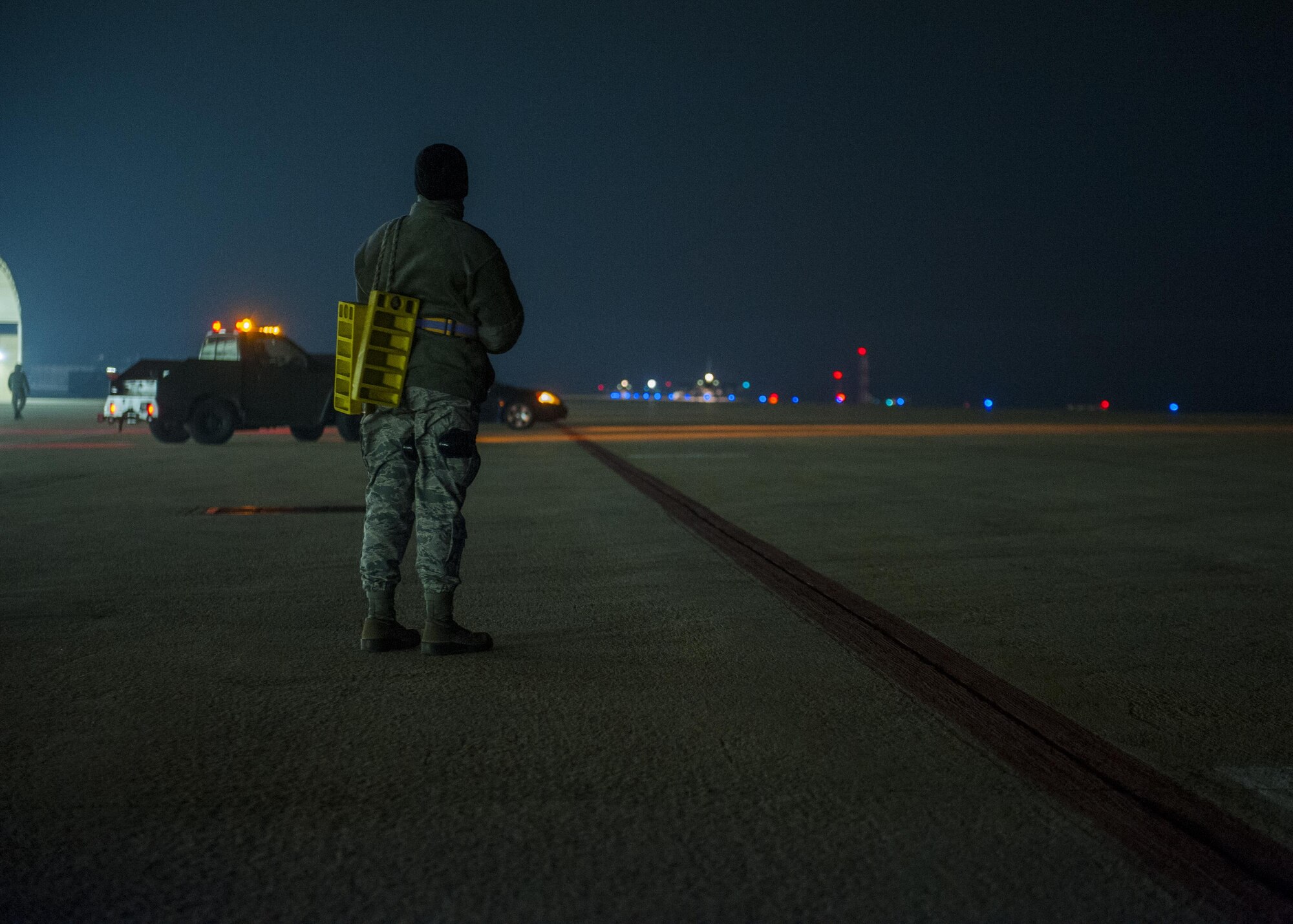 An Airman with the Wisconsin Air National Guard’s 115th Fighter Wing watches as the last of the unit’s F-16 Fighting Falcons taxi toward the end of the runway at Kunsan Air Base, Republic of Korea, Nov. 4, 2017. The aircraft and Airmen assigned to the 115th spent approximately three months on the Korean Peninsula in support of U.S. Pacific Command’s priority to secure and maintain peace in the Indo-Asia-Pacific region. (U.S. Air Force photo by Capt. Christopher Mesnard)