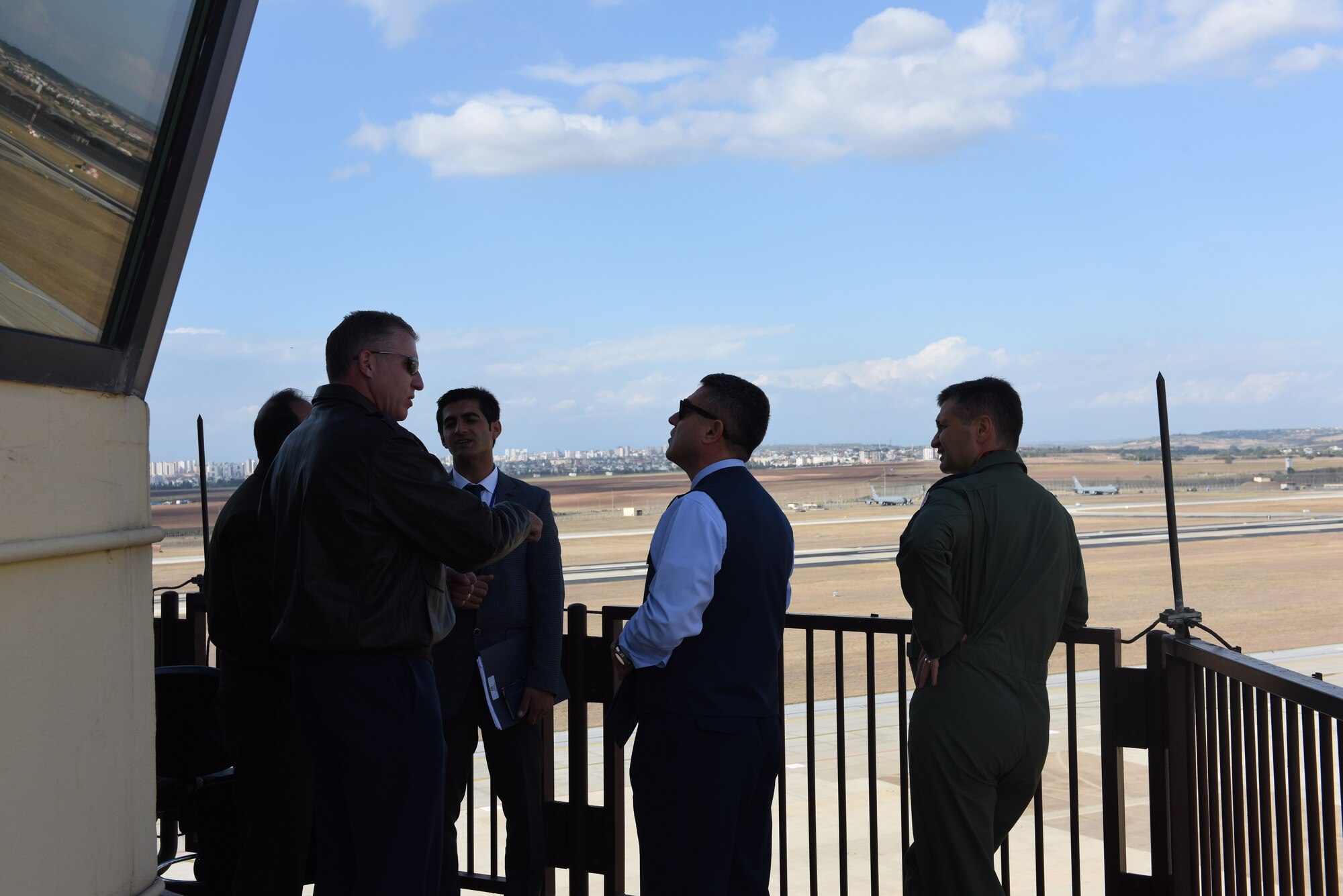 Col. David Eaglin, 39th Air Base Wing commander, talks with Brig. Gen. Necati Gunduz and Brig. Gen. Ismail Gunaydin at the tower during the Defense and Economic Cooperation Agreement inspection at Incirlik Air Base, Turkey, Oct. 30, 2017.