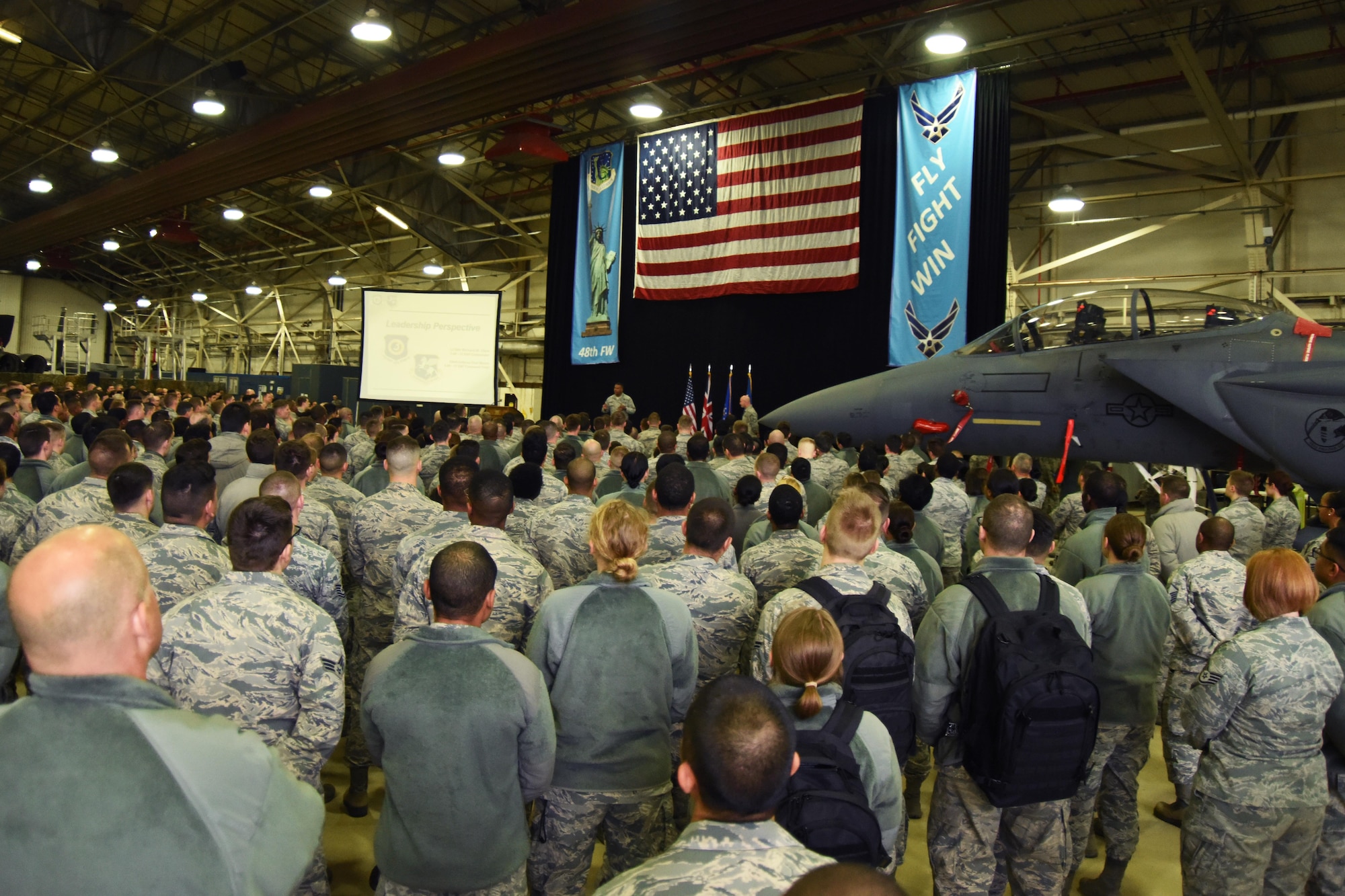 A crowd of Airmen from the 48th Fighter Wing listen to Lt. Gen. Richard M. Clark, 3rd Air Force Commander, speak during his presentation at Royal Air Force Lakenheath, England, Nov. 7. The general handed out various awards to outstanding Airmen for their contributions towards the mission. (U.S. Air Force photo/Airman 1st Class Christopher S. Sparks)