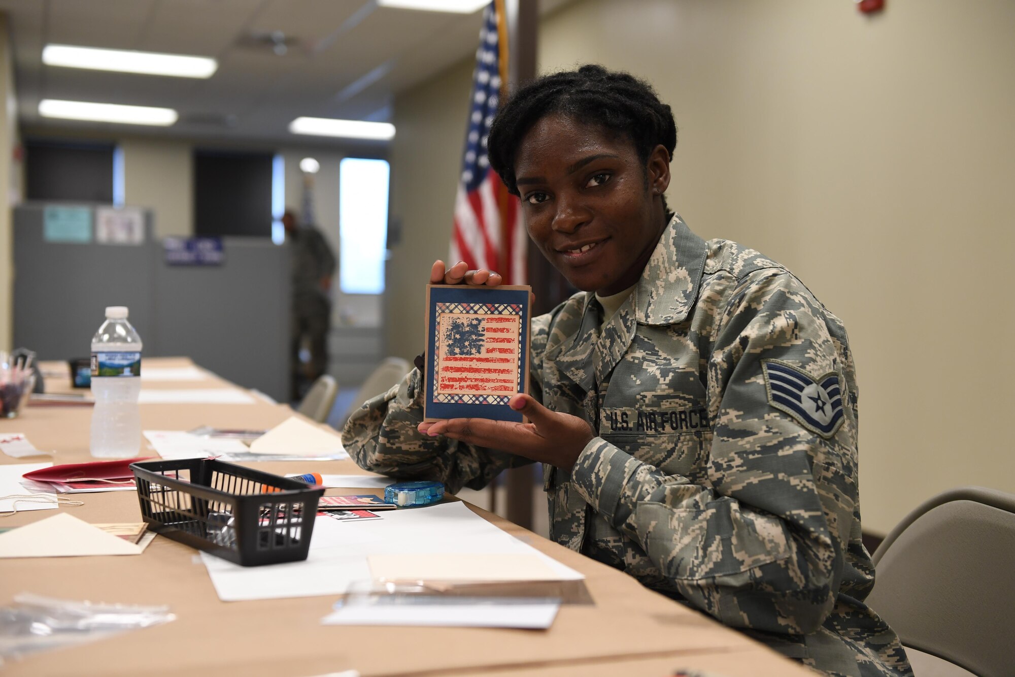 Staff Sgt. Dakia Kimbrough, Logistics Manager with the 911th Logistics Readiness Squadron, puts together a card at the Pittsburgh International Airport Air Reserve Station, Pa., November 5th, 2017. Kimbrough was participating in a card-making event to assist family members in making greeting cards for their deployed service members. (U.S. Air Force photo by Senior Airman Beth Kobily)