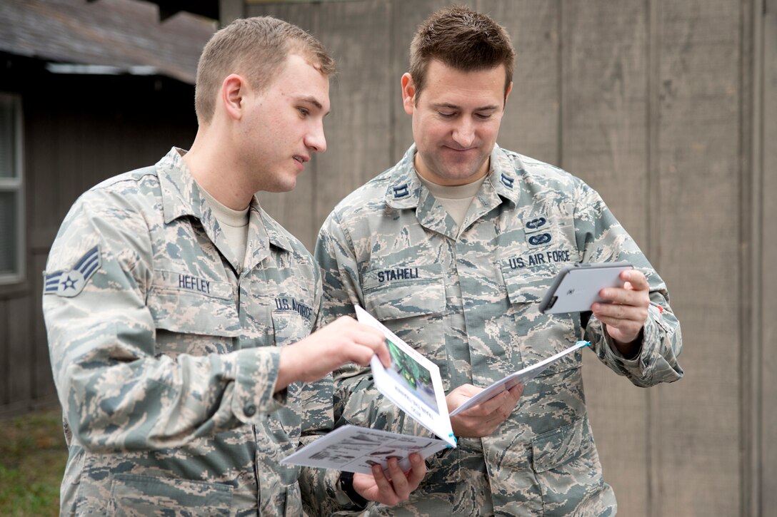 U.S. Air Force Reserve Senior Airman Jonathan Hefley, aerospace medic, 913th Aerospace medical Squadron makes a SALUTE report from a surveillance photo, to Capt. Casey Staheli, public affairs officer, 913th Airlift Group, during “Ability to Survive and Operate” (ATSO) training Nov. 4, 2017, at Little Rock Air Force Base, Ark.