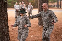 U.S. Air Force Reserve Master Sgt. Dennis P. Kash, first sergeant, 913th Force Support Squadron, plays safety monitor for a team building exercise during “Ability to Survive and Operate” training Nov. 4, 2017, at Little Rock Air Force Base, Ark.
